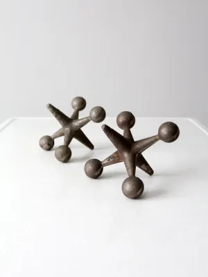 mid-century cast iron jacks pair
