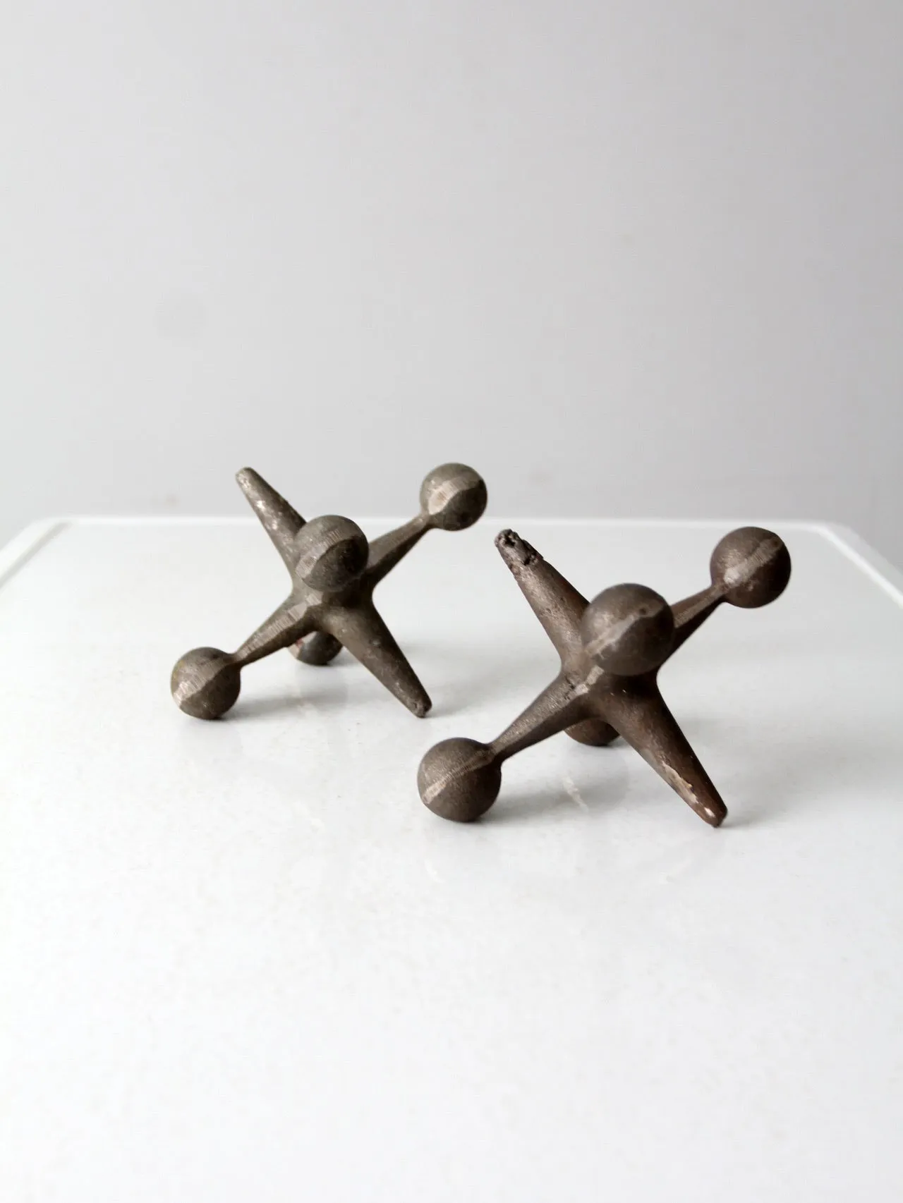 mid-century cast iron jacks pair