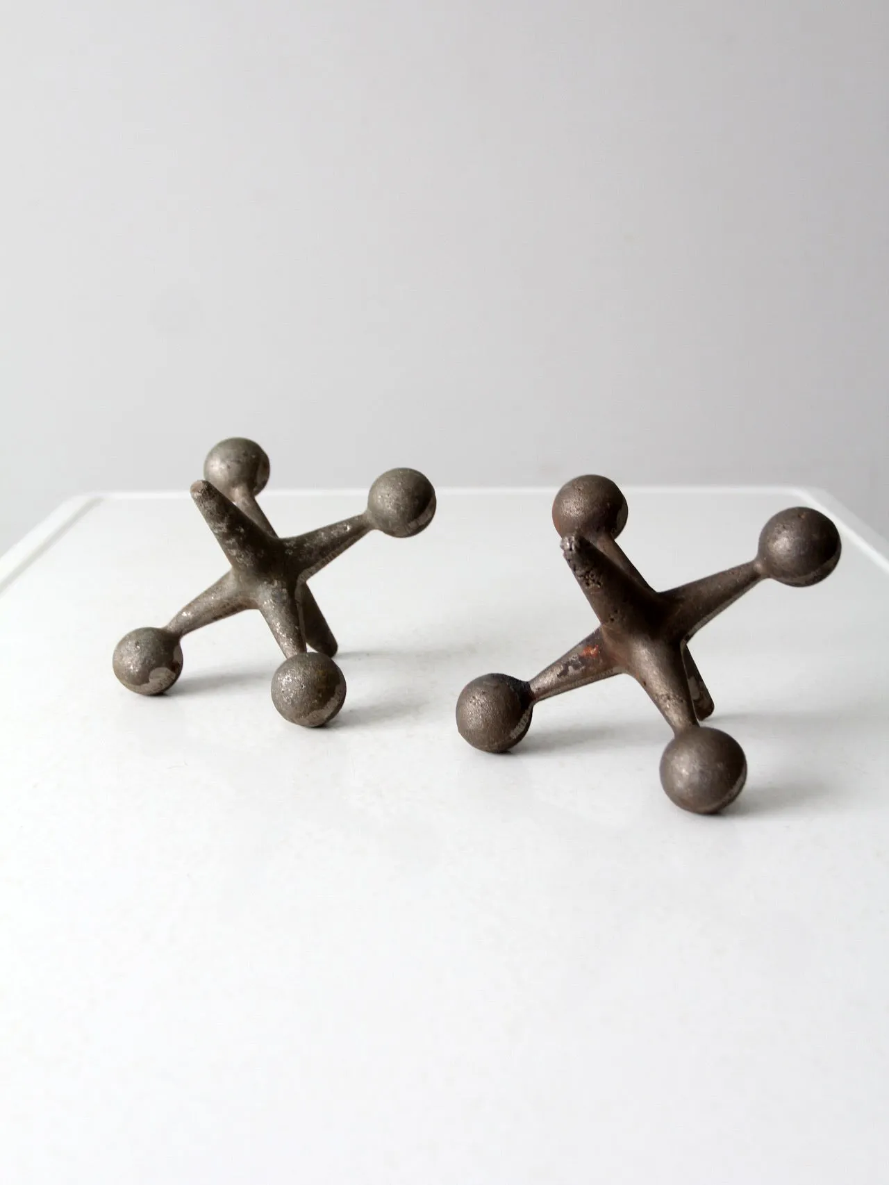 mid-century cast iron jacks pair