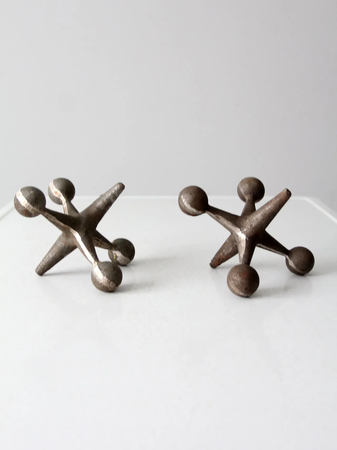 mid-century cast iron jacks pair