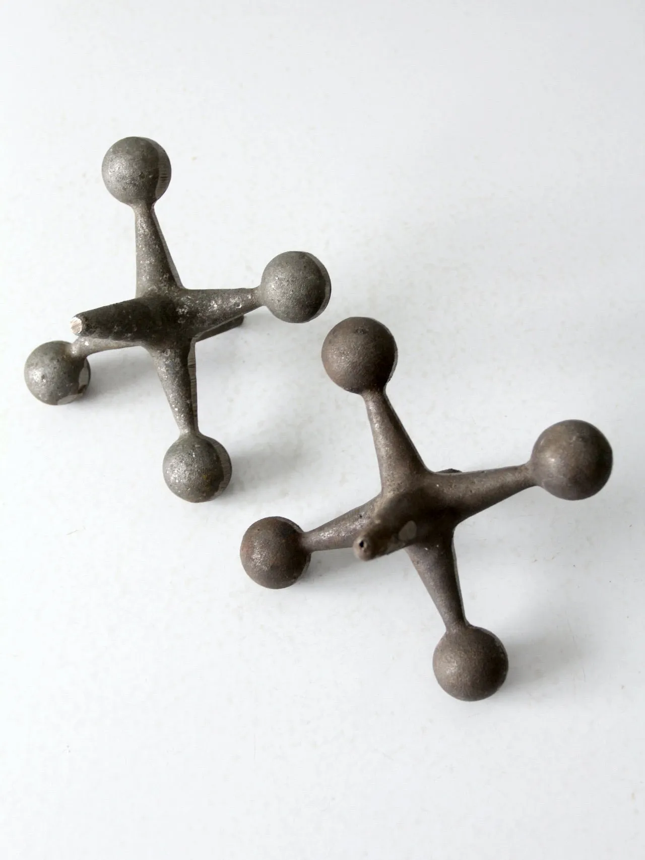 mid-century cast iron jacks pair