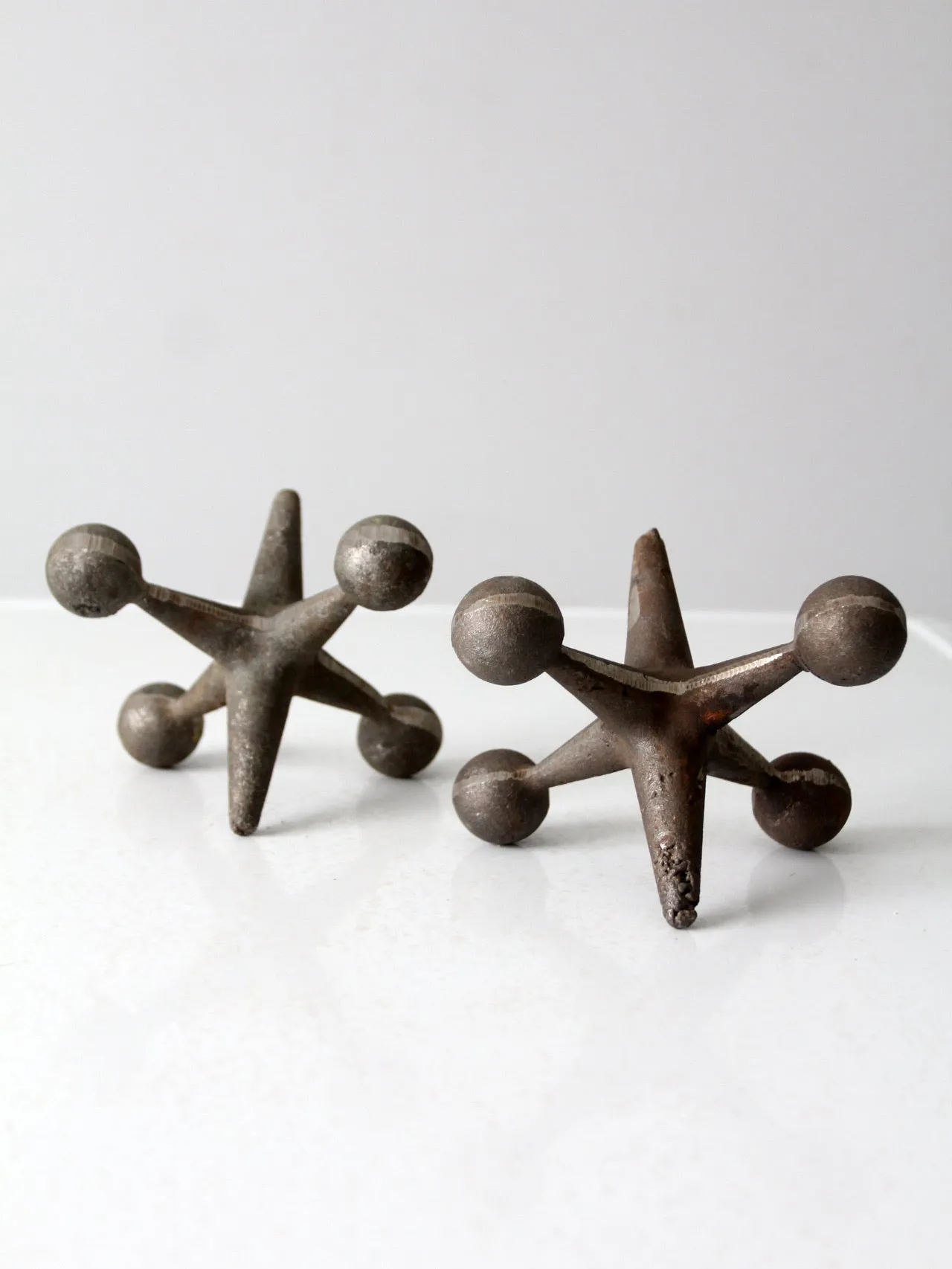 mid-century cast iron jacks pair