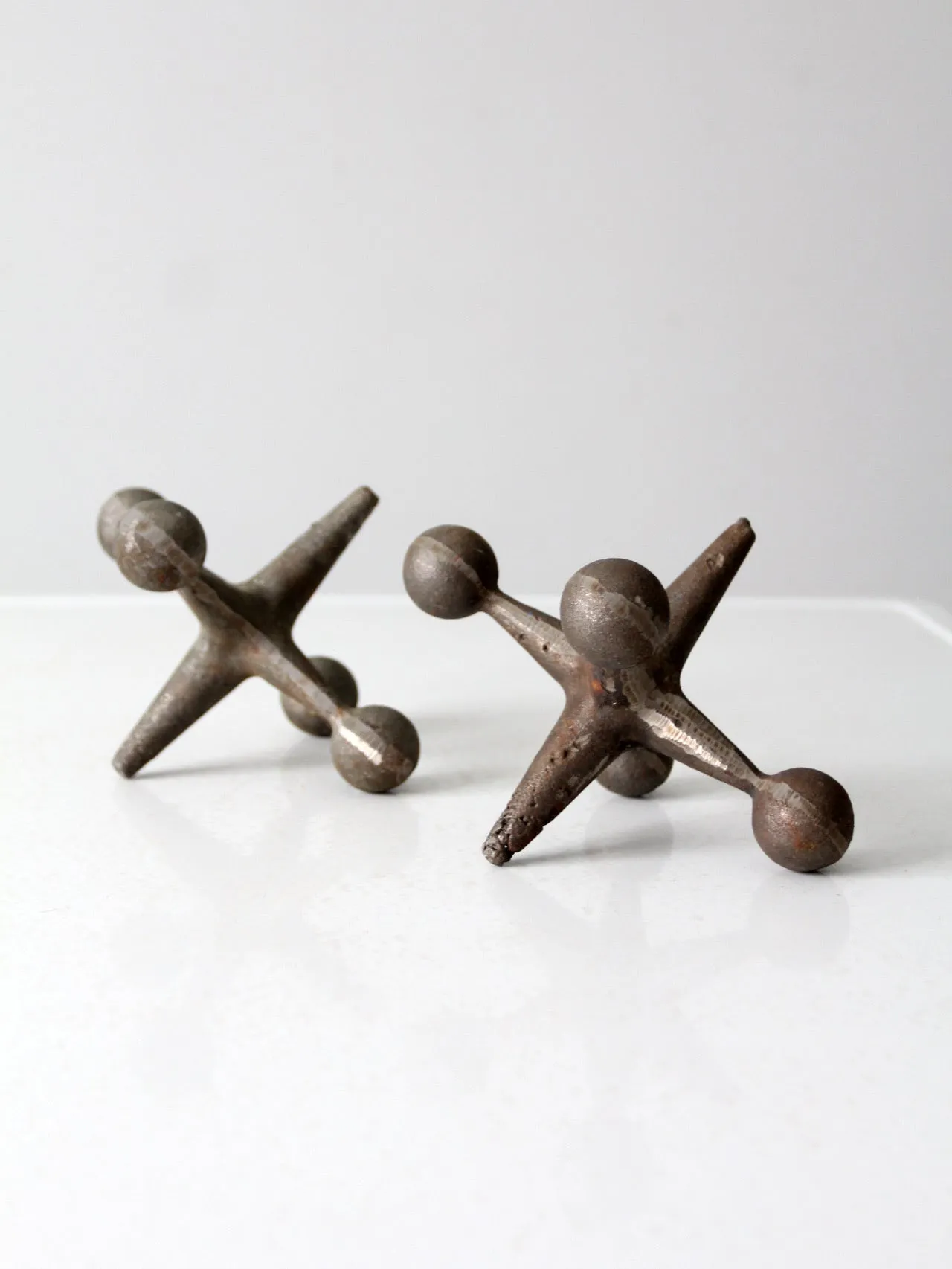 mid-century cast iron jacks pair