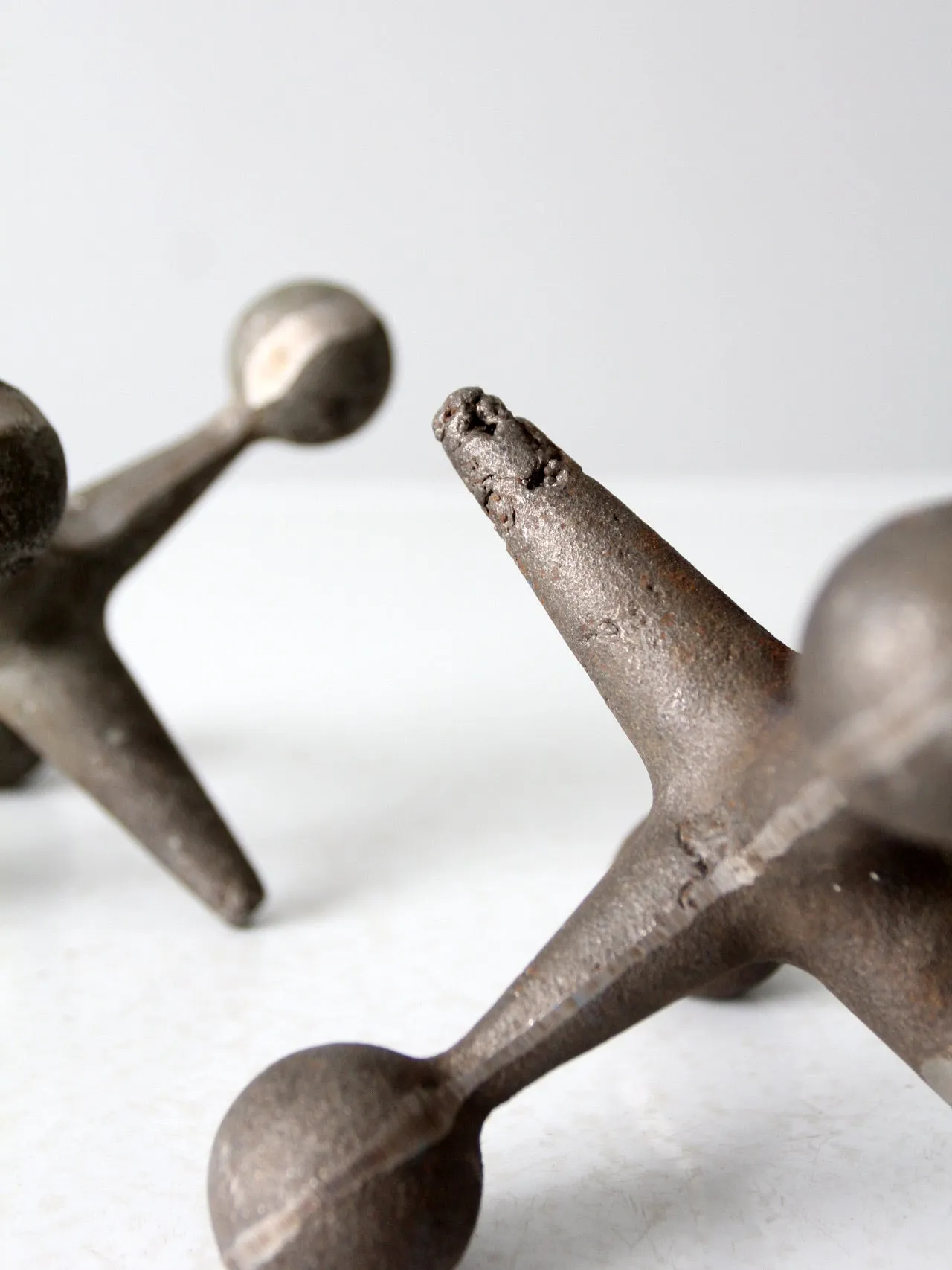 mid-century cast iron jacks pair