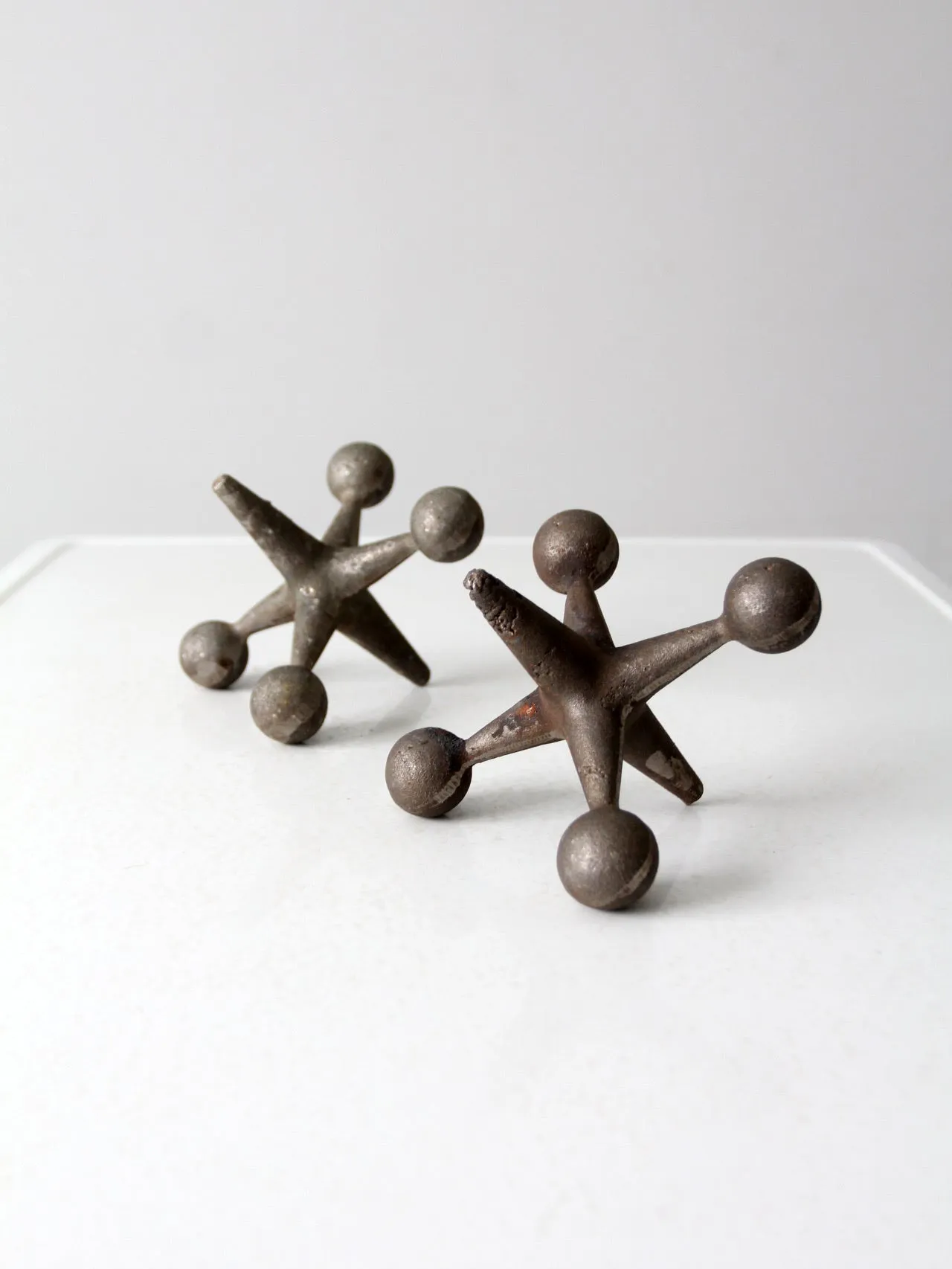 mid-century cast iron jacks pair